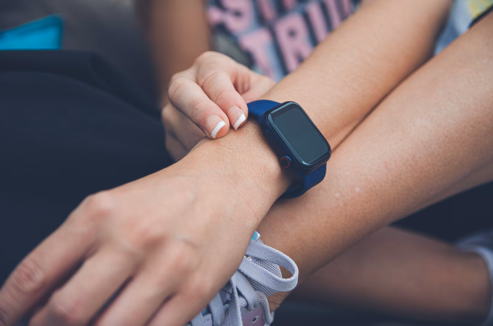 Close-up of an Apple Watch showing the display and side button